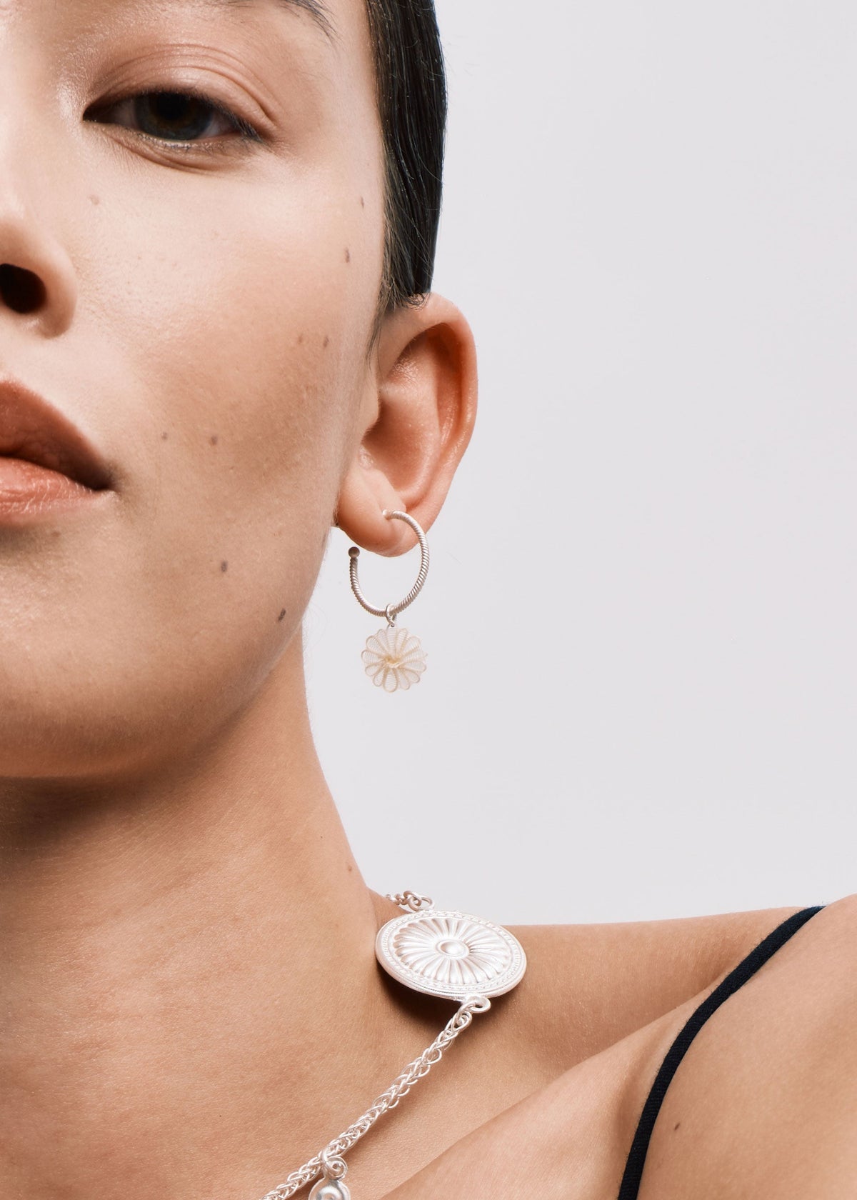 DISTANT HANDS Horsehair Flower Hoop Earrings — official model photograph