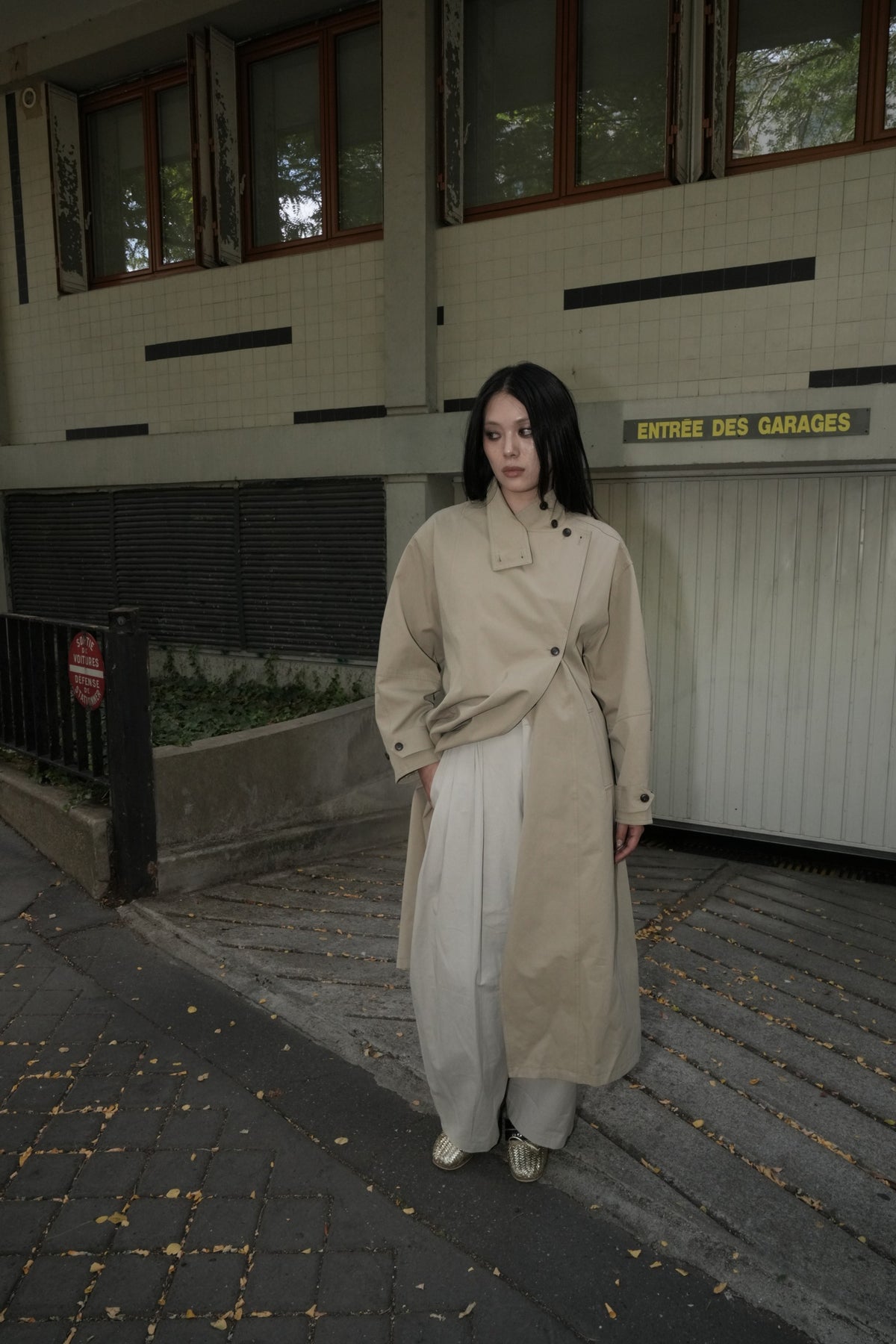 Beige AW26 Asymmetric Stand-Collar Belted Trench worn by a model