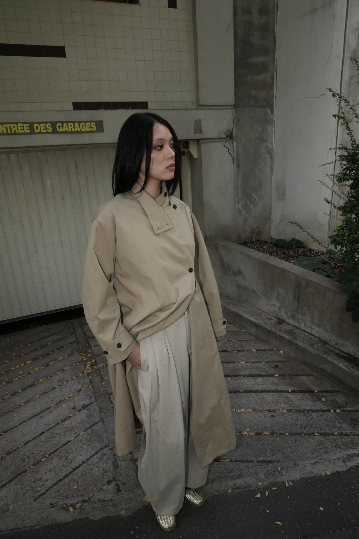 Beige AW26 Asymmetric Stand-Collar Belted Trench worn by a model